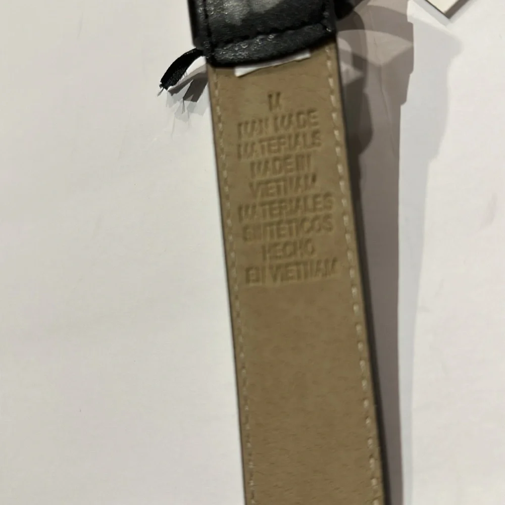 Black Vegan leather belt with silver tone buckle fits approximately 31-36”